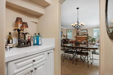 a bathroom with a sink vanity granite and toilet