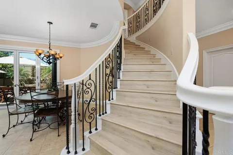 a view of a living room and entryway