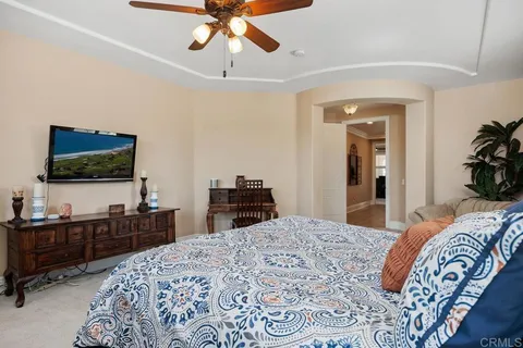 a spacious bathroom with a granite countertop sink mirror and bathtub