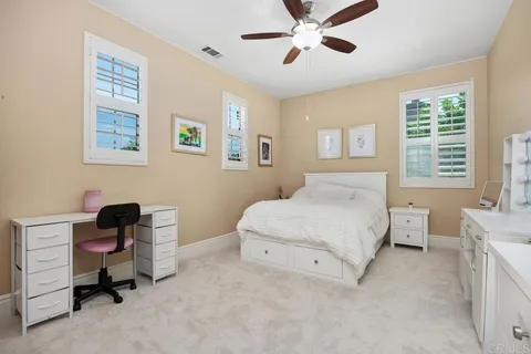 a bathroom with a sink a toilet and shower curtain