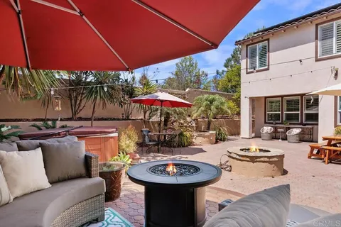 a building outdoor space with patio furniture and garden