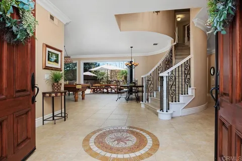 a view of a livingroom with furniture and a potted plant
