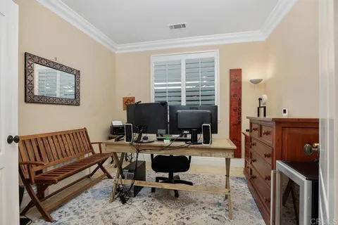 a kitchen with refrigerator and cabinets