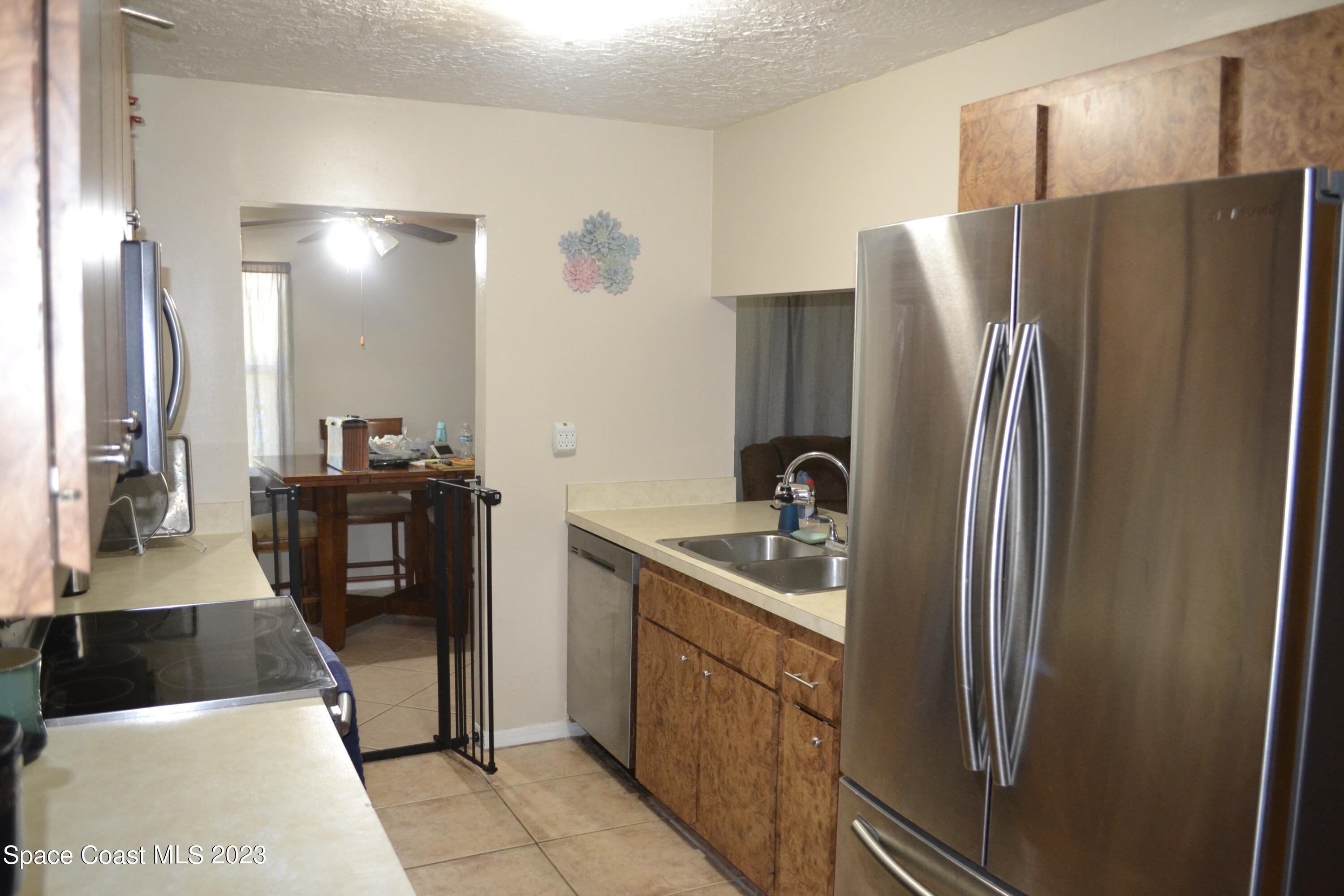3910 Delespine Road Cocoa, FL 32927 - Photo 11 of 21 a kitchen with stainless steel appliances granite countertop a refrigerator and a sink