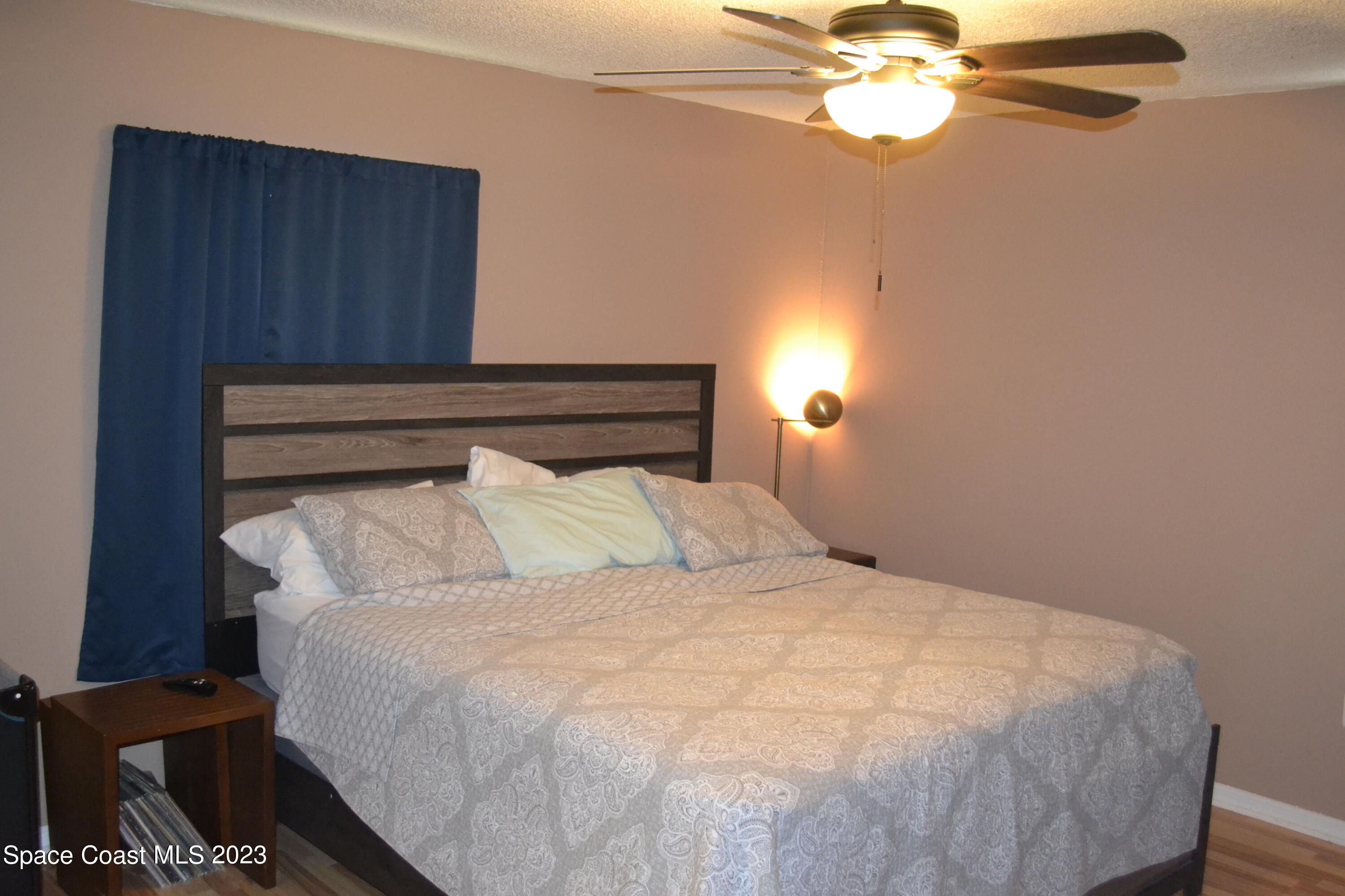 3910 Delespine Road Cocoa, FL 32927 - Photo 12 of 21 a bedroom with a bed and a chandelier