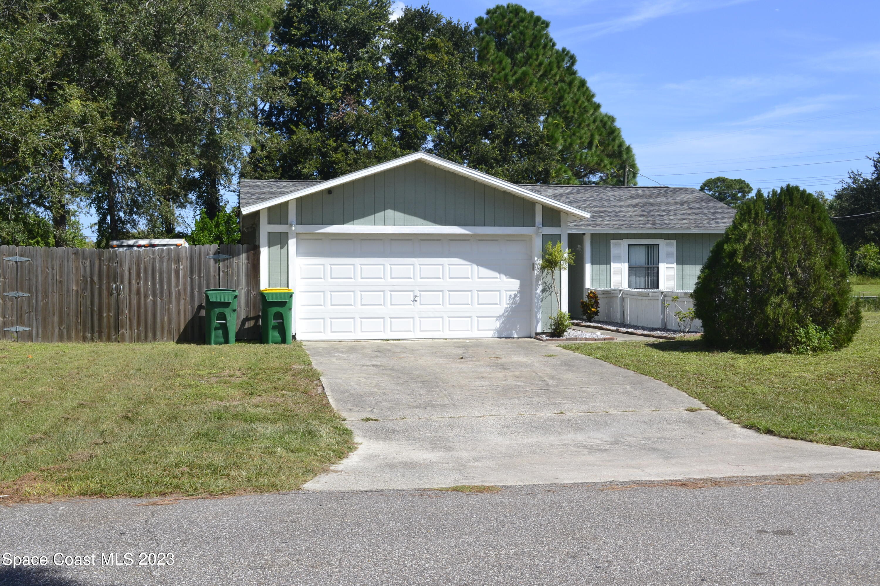 3910 Delespine Road Cocoa, FL 32927 - Photo 21 of 21 a front view of a house with a garden and plants