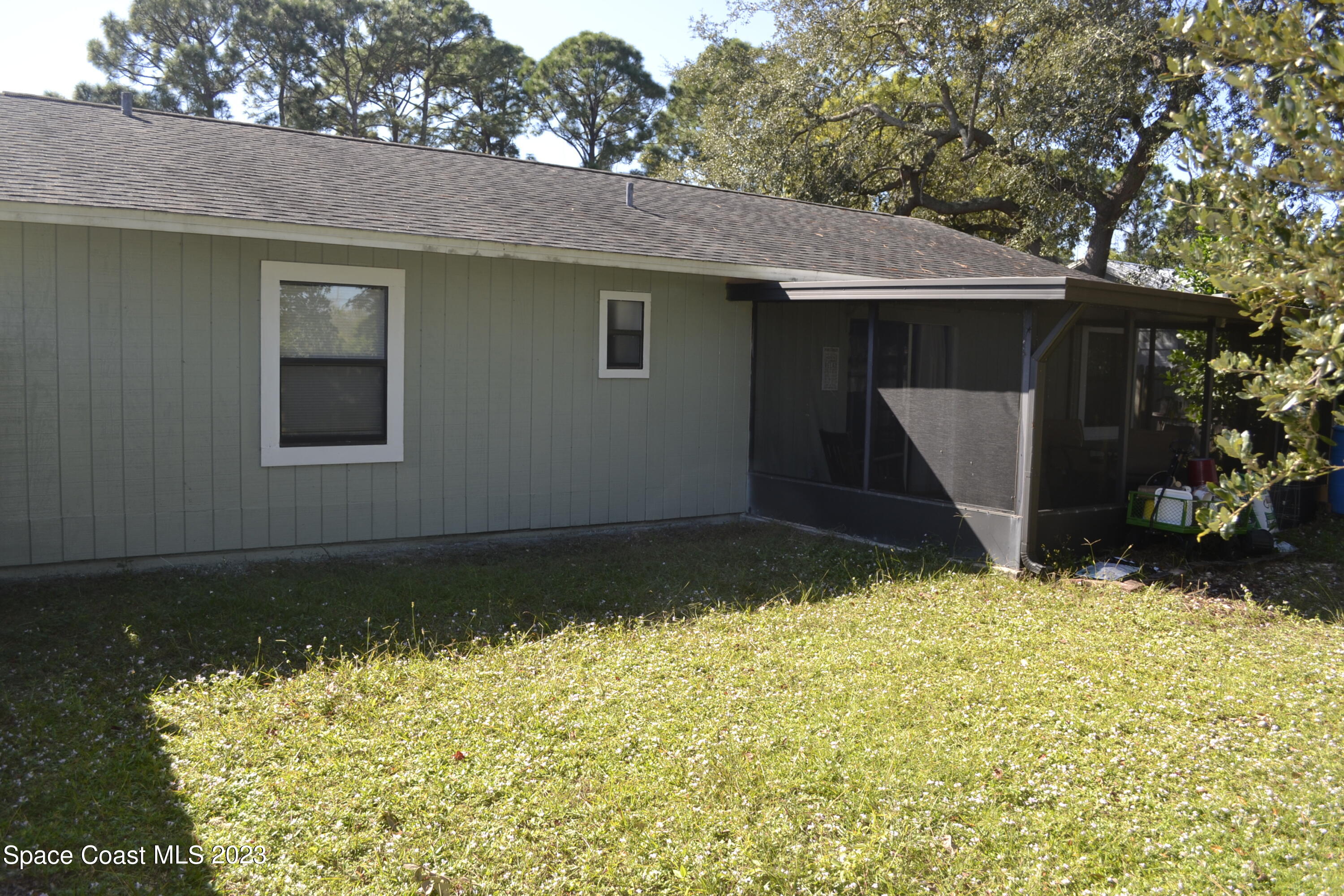 3910 Delespine Road Cocoa, FL 32927 - Photo 6 of 21 a house with trees in the background