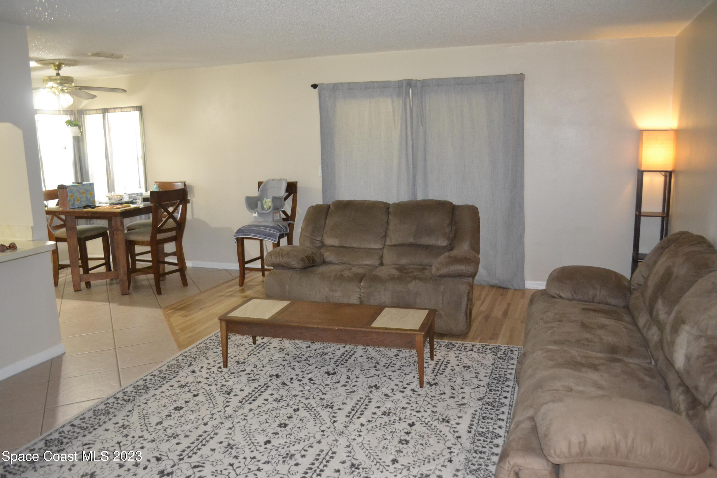 3910 Delespine Road Cocoa, FL 32927 - Photo 7 of 21 a living room with furniture and a couch