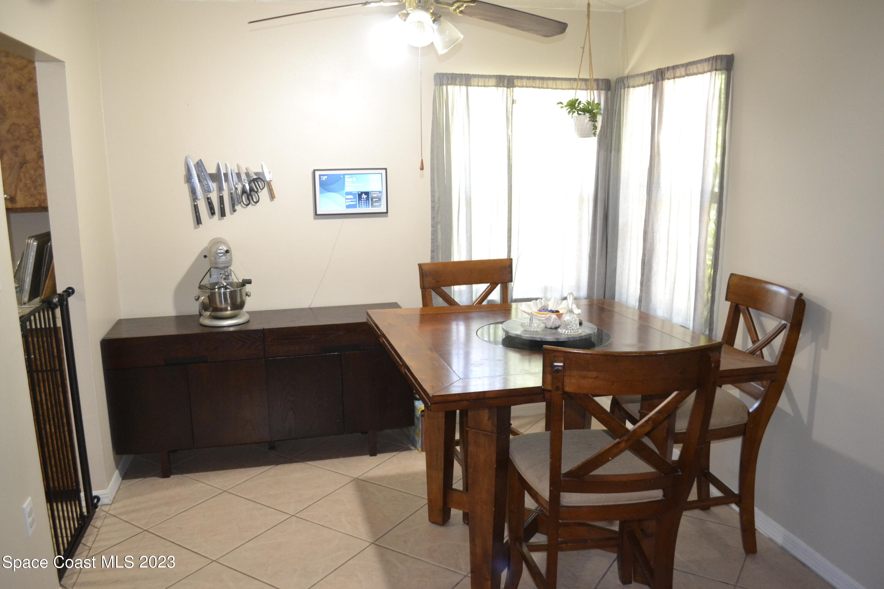 3910 Delespine Road Cocoa, FL 32927 - Photo 9 of 21 a view of a dining room with furniture and window