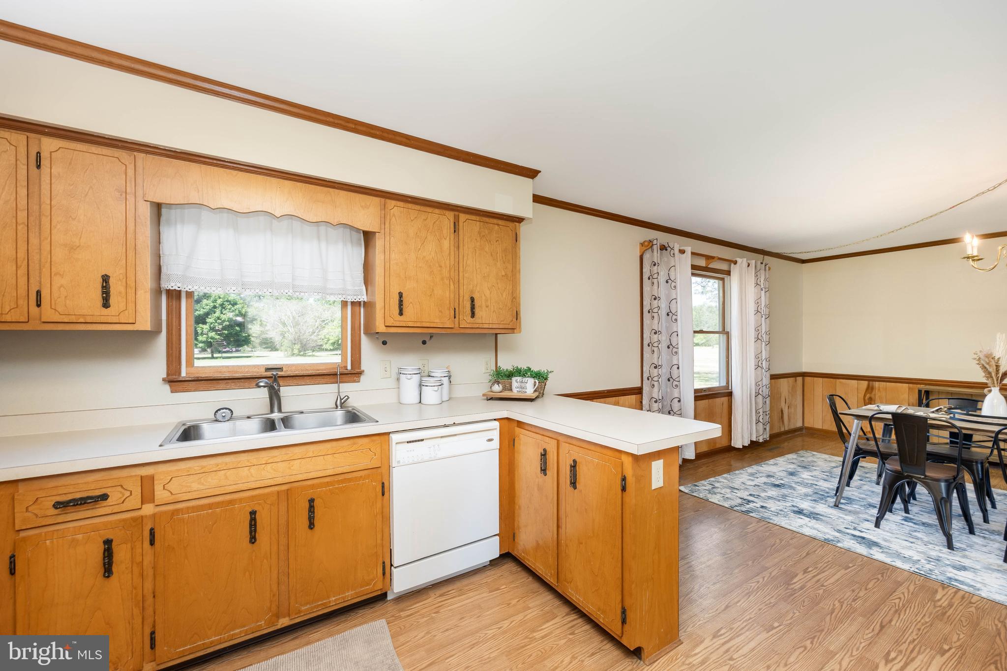 9830 Sharptown Road Mardela Springs, MD 21837 - Photo 6 of 51 a kitchen with a sink stove and cabinets