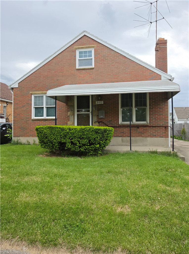 3109 Shroyer Road Kettering, OH 45429 - Photo 1 of 25 This classic brick residence offers a welcoming facade with a well-maintained lawn.
