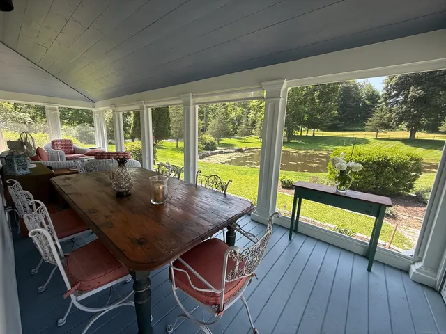 a view of a dining room with furniture window and outside view