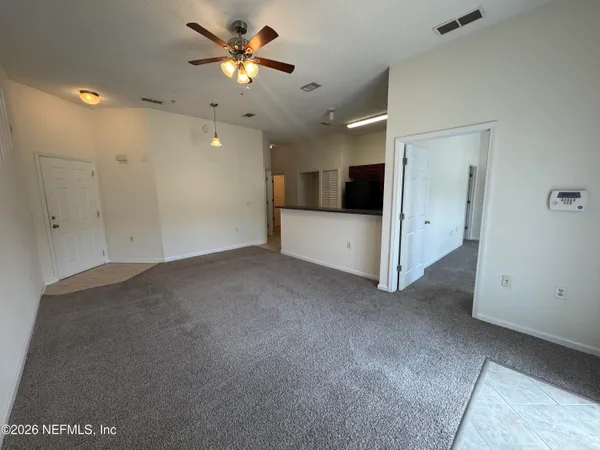 a view of a livingroom with a ceiling fan
