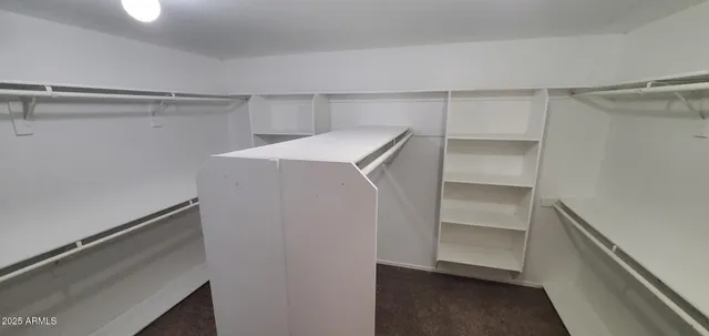 a view of a porch with furniture and a yard