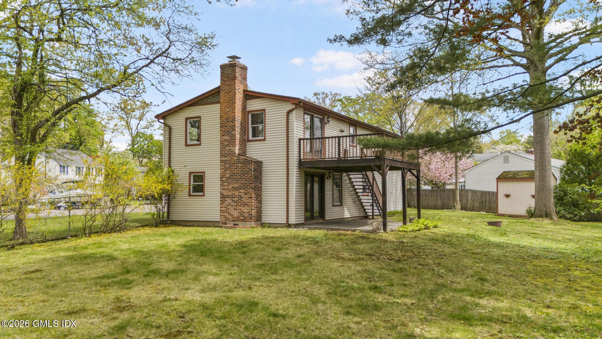 22 Carrona Drive Riverside, CT 06878 - Photo 21 of 26 a front view of a house with a yard