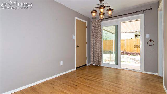 4027 Maxwell Road Colorado Springs, CO 80909 - Photo 10 of 35 Dining room off the living room and the kitchen is on the right side.