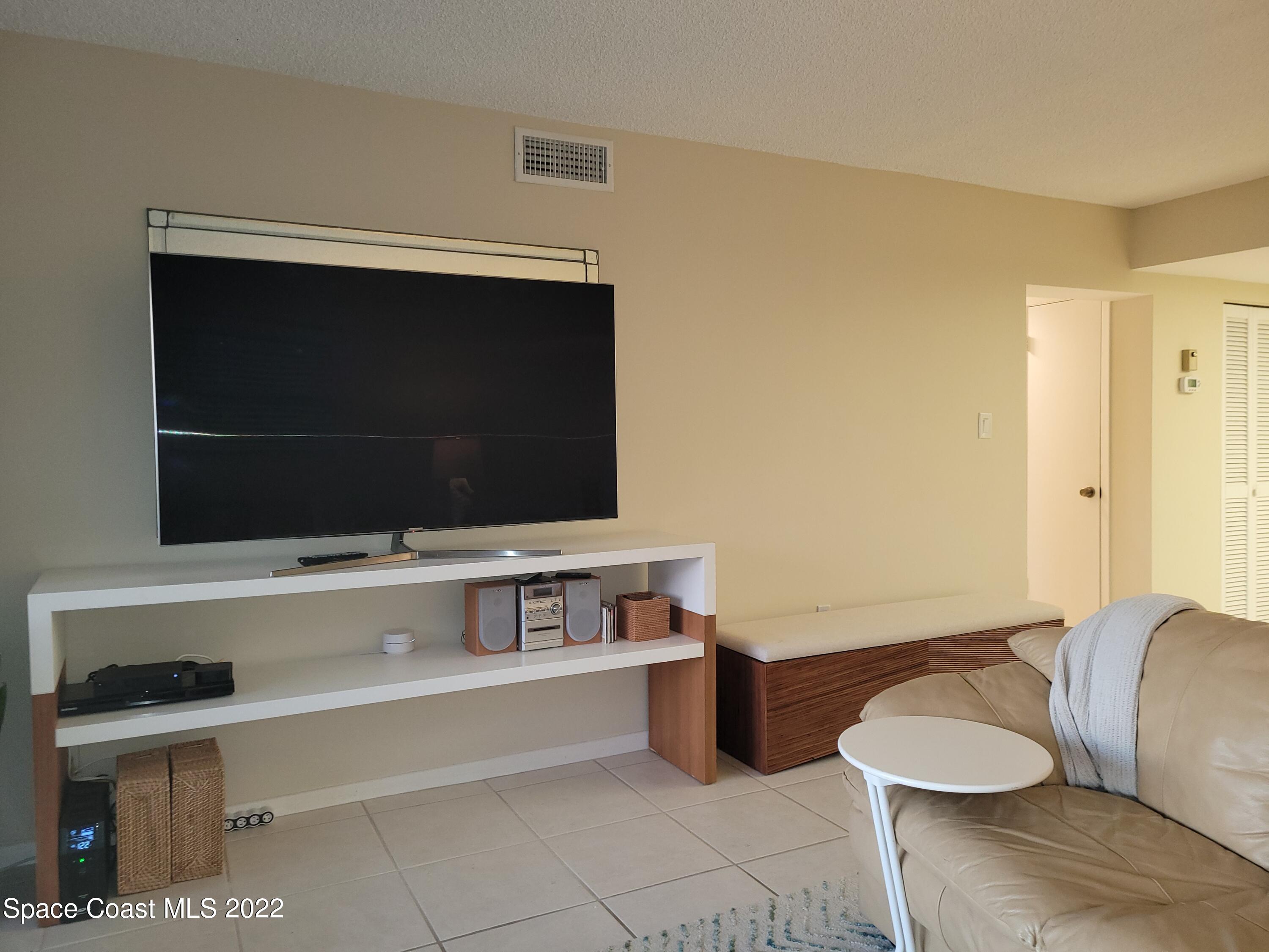 1251 South Atlantic Avenue, Unit 201 Cocoa Beach, FL 32931 - Photo 13 of 43 Large smart Samsung TV