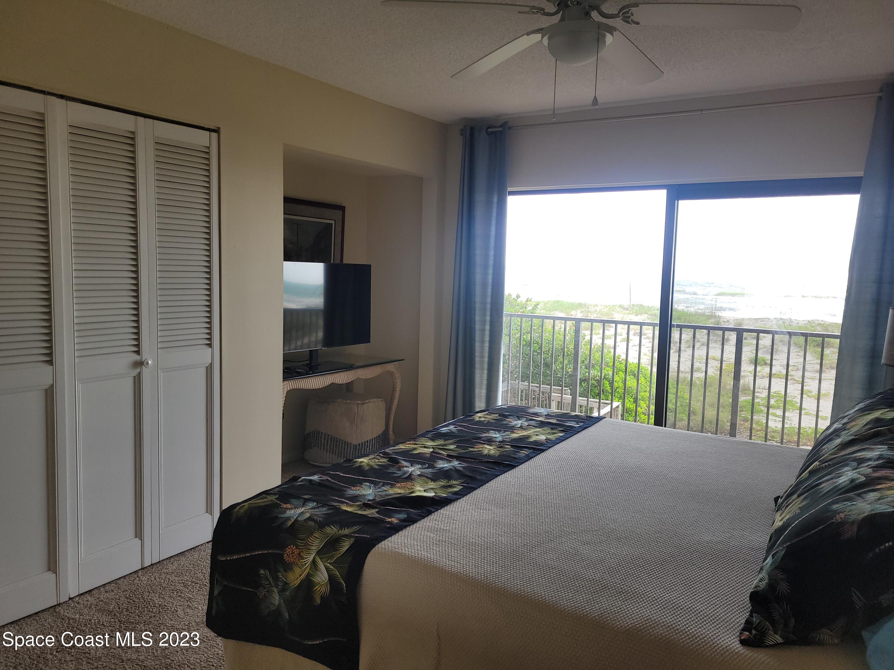 1251 South Atlantic Avenue, Unit 201 Cocoa Beach, FL 32931 - Photo 20 of 43 Master Bedroom Balcony
