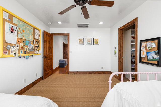 892 Cambridge Drive St. George, UT 84770 - Photo 40 of 65 Interior room featuring wood-finish doors, wood-finish trim, and a patterned carpet
