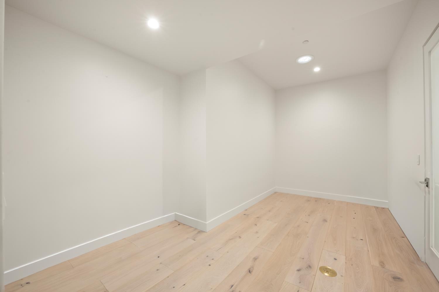 3630 Winding Creek Road Sacramento, CA 95864 - Photo 26 of 74 an empty room with wooden floor and white walls