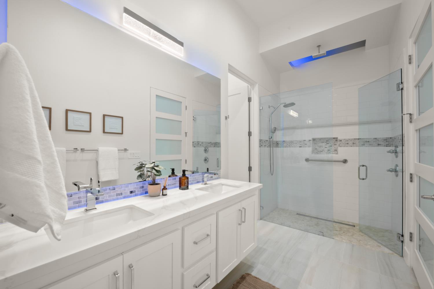 3630 Winding Creek Road Sacramento, CA 95864 - Photo 52 of 74 a bathroom with a double vanity sink mirror and shower
