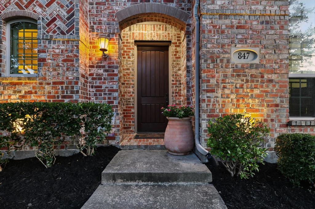 847 Twilight Road Allen, TX 75013 - Photo 1 of 1 a view of a brick house with potted plants