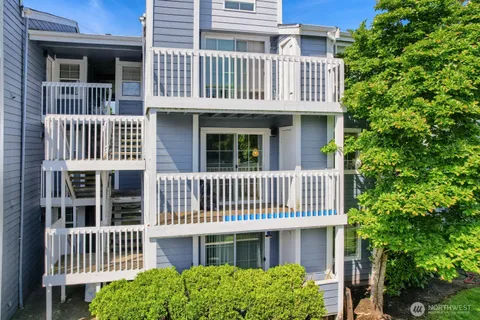 a front view of a house with a deck