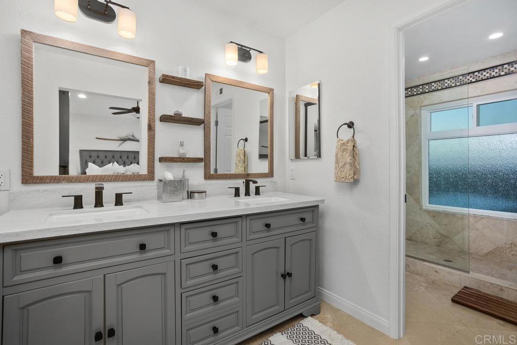 2063 Wandering Road Encinitas, CA 92024 - Photo 13 of 23 a bathroom with a double vanity sink mirror and double