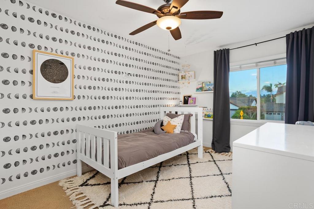 2063 Wandering Road Encinitas, CA 92024 - Photo 17 of 23 a view of a hallway with a dining table and a stove