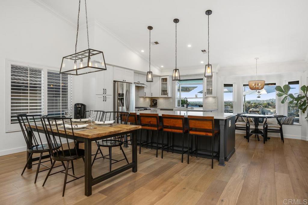 2063 Wandering Road Encinitas, CA 92024 - Photo 5 of 23 a dining room filled with furniture and wooden floor