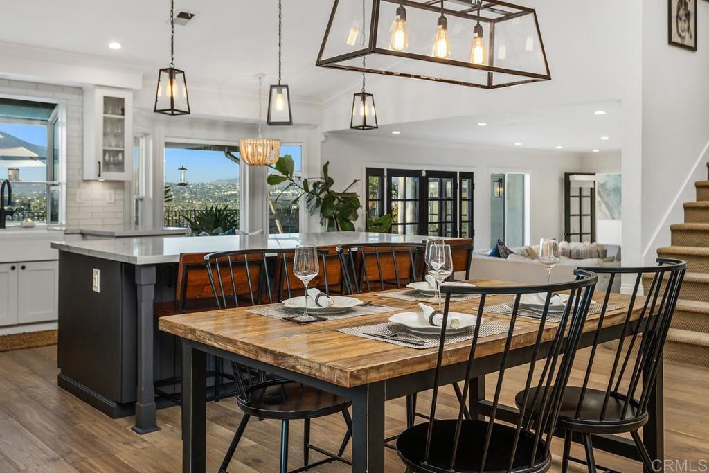 2063 Wandering Road Encinitas, CA 92024 - Photo 6 of 23 a view of a dining room with furniture and wooden floor