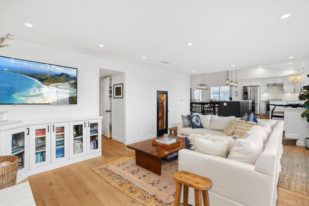 2063 Wandering Road Encinitas, CA 92024 - Photo 10 of 23 a living room with furniture and a dining table with kitchen view