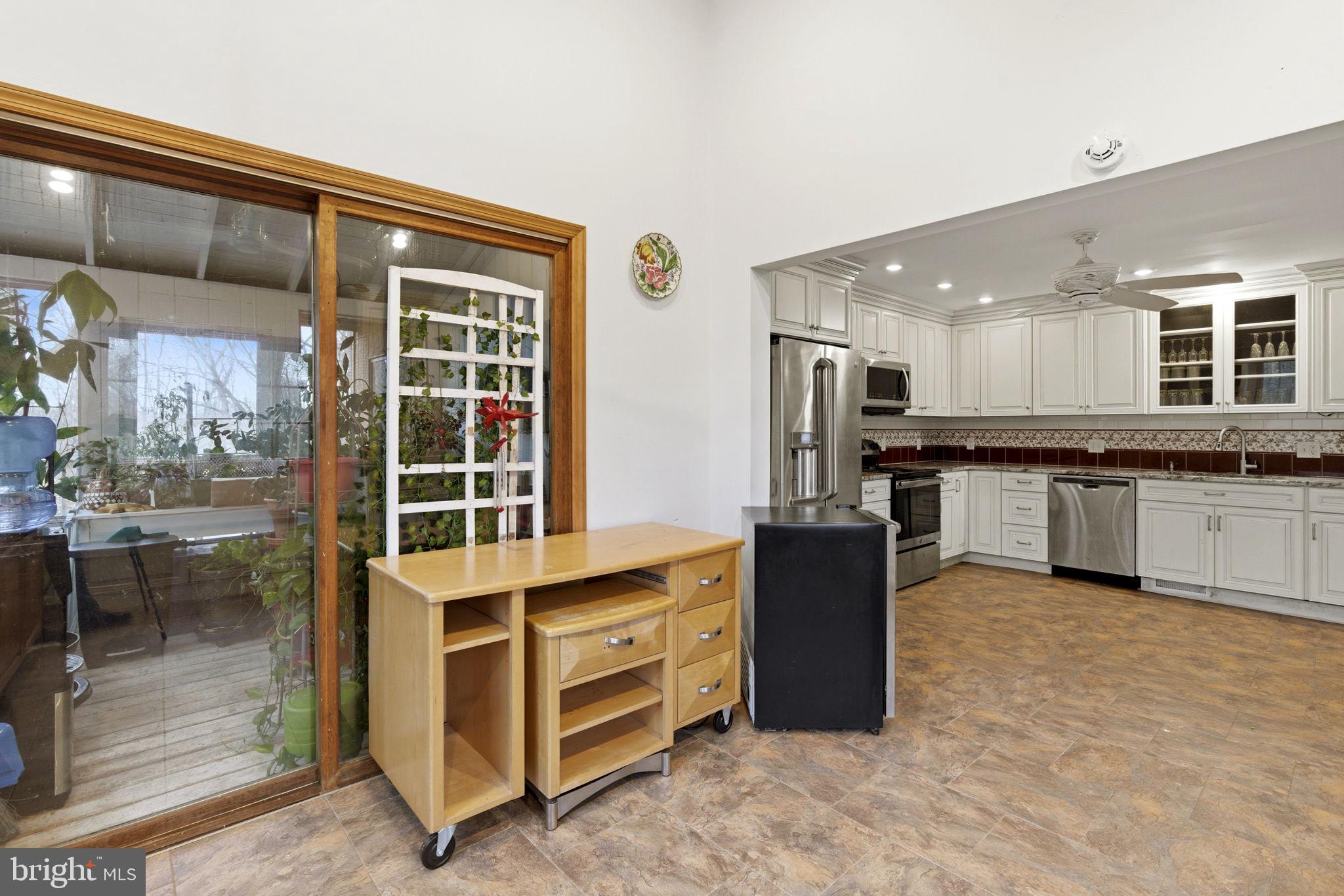 1655 Old Elk Neck Road Elkton, MD 21921 - Photo 11 of 43 a kitchen with stainless steel appliances granite countertop a stove and a refrigerator