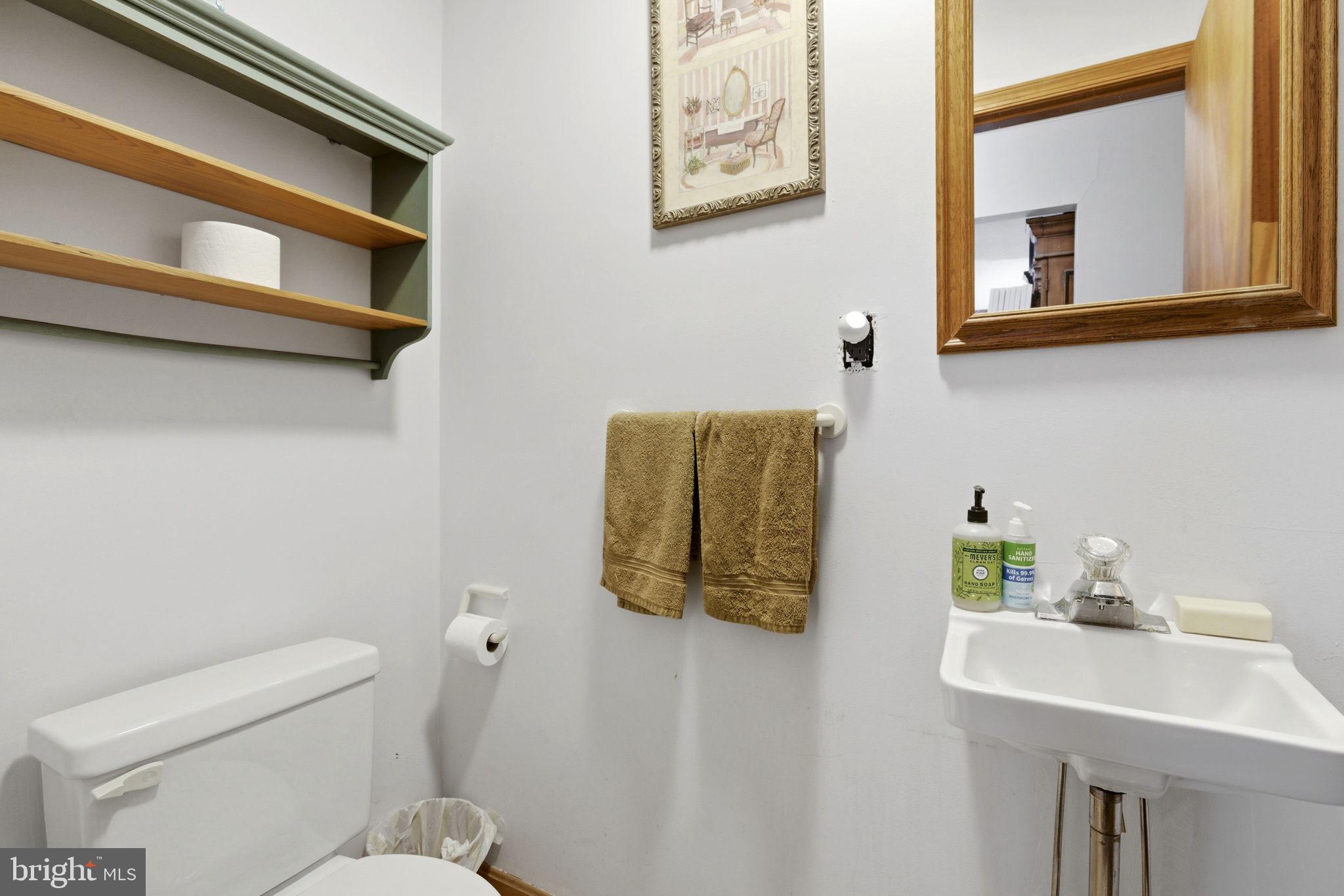 1655 Old Elk Neck Road Elkton, MD 21921 - Photo 15 of 43 a bathroom with a toilet sink and mirror