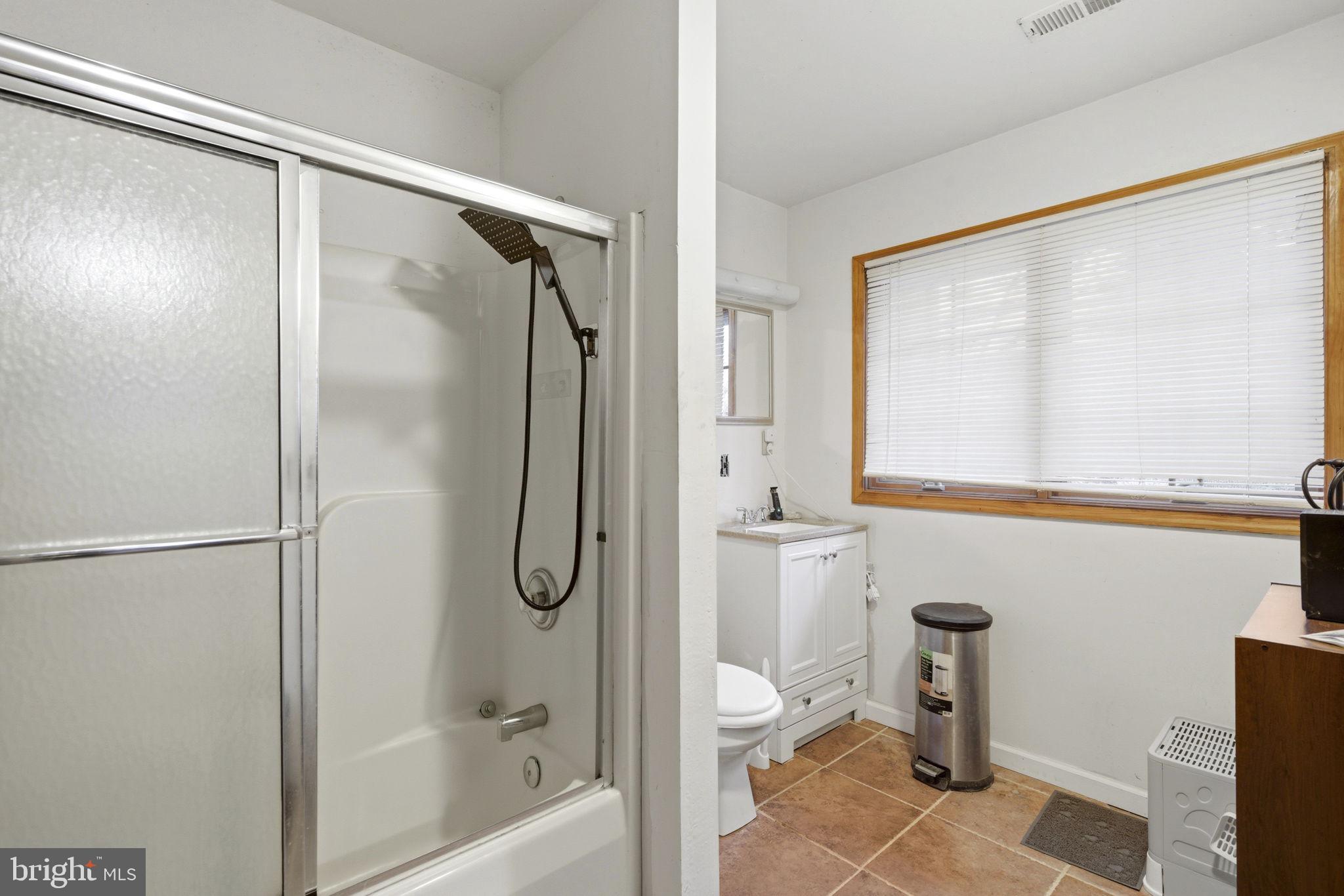 1655 Old Elk Neck Road Elkton, MD 21921 - Photo 20 of 43 a bathroom with a granite countertop shower a toilet and a sink