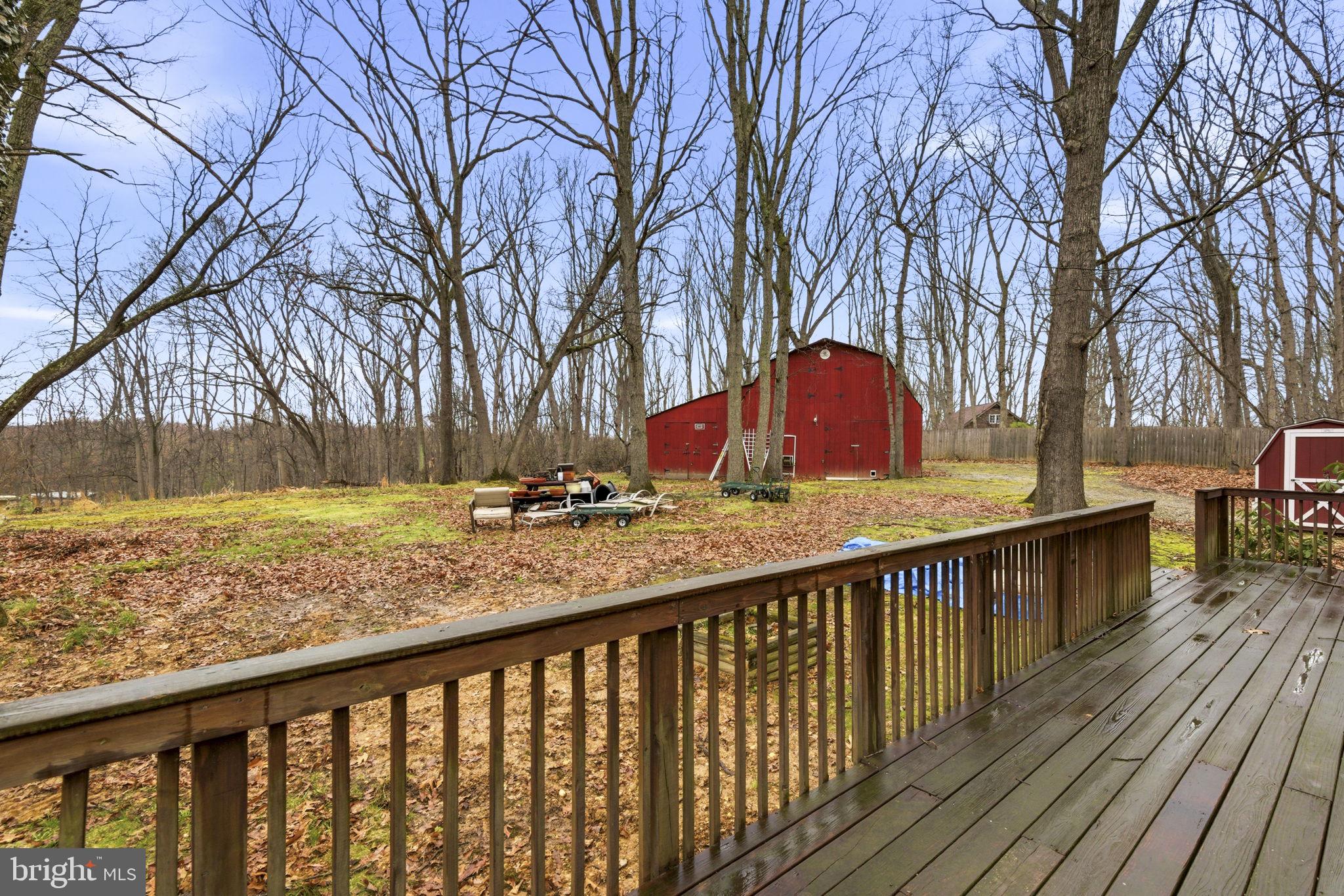 1655 Old Elk Neck Road Elkton, MD 21921 - Photo 27 of 43 a view of a wooden deck and trees with wooden fence