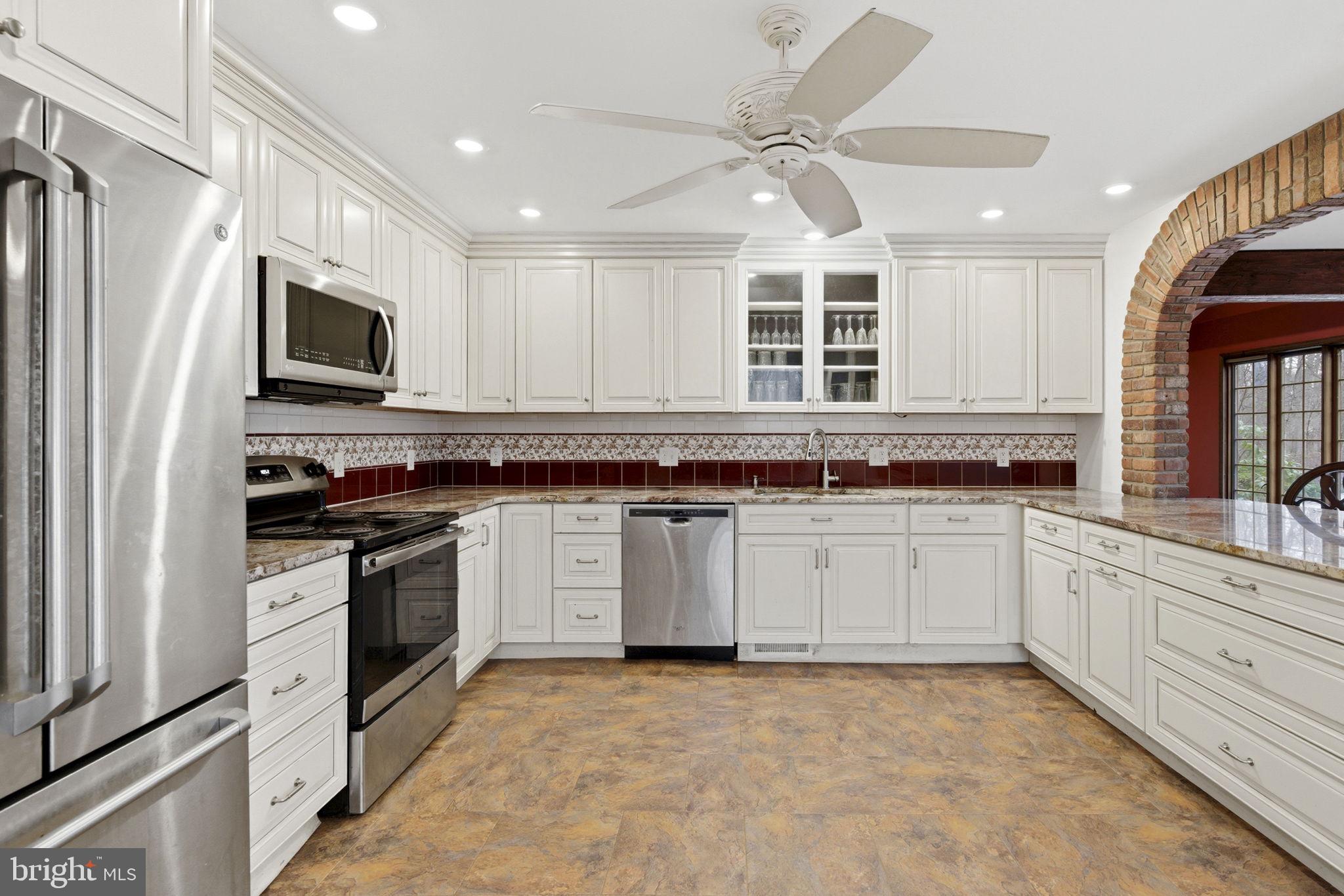 1655 Old Elk Neck Road Elkton, MD 21921 - Photo 7 of 43 a kitchen with stainless steel appliances granite countertop a stove and a sink