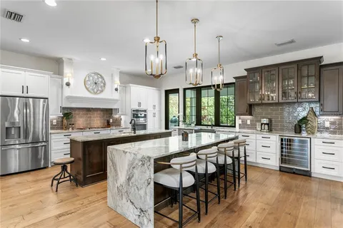 a kitchen with a window a sink and a cabinets