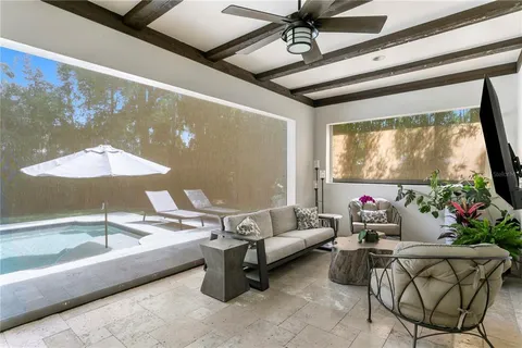 a swimming pool with outdoor seating and yard