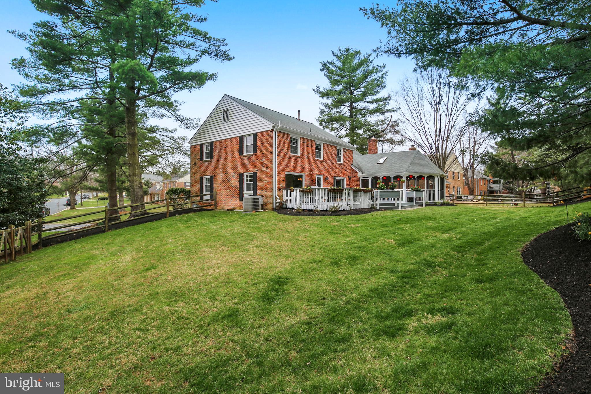 8801 Cold Spring Road Potomac, MD 20854 - Photo 41 of 44 a front view of a house with garden