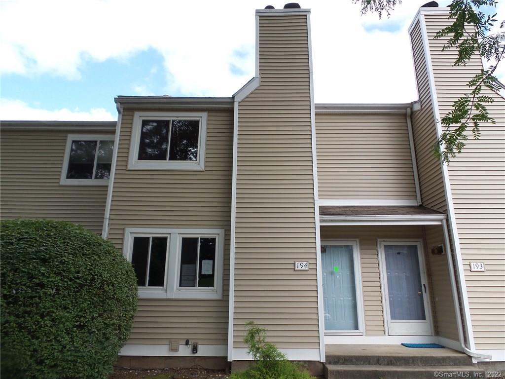 a view of a house with more windows and brick walls