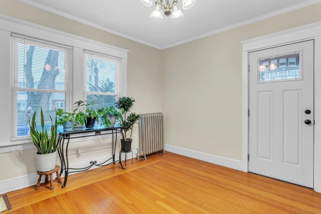 754 White Street Springfield, MA 01108 - Photo 16 of 41 a view of a workspace with furniture and a potted plant