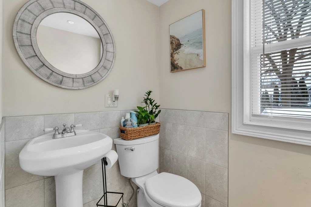 754 White Street Springfield, MA 01108 - Photo 21 of 41 a bathroom with a toilet a sink and a mirror