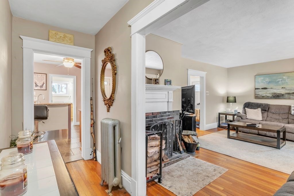 754 White Street Springfield, MA 01108 - Photo 22 of 41 a living room with furniture a fireplace and a flat screen tv