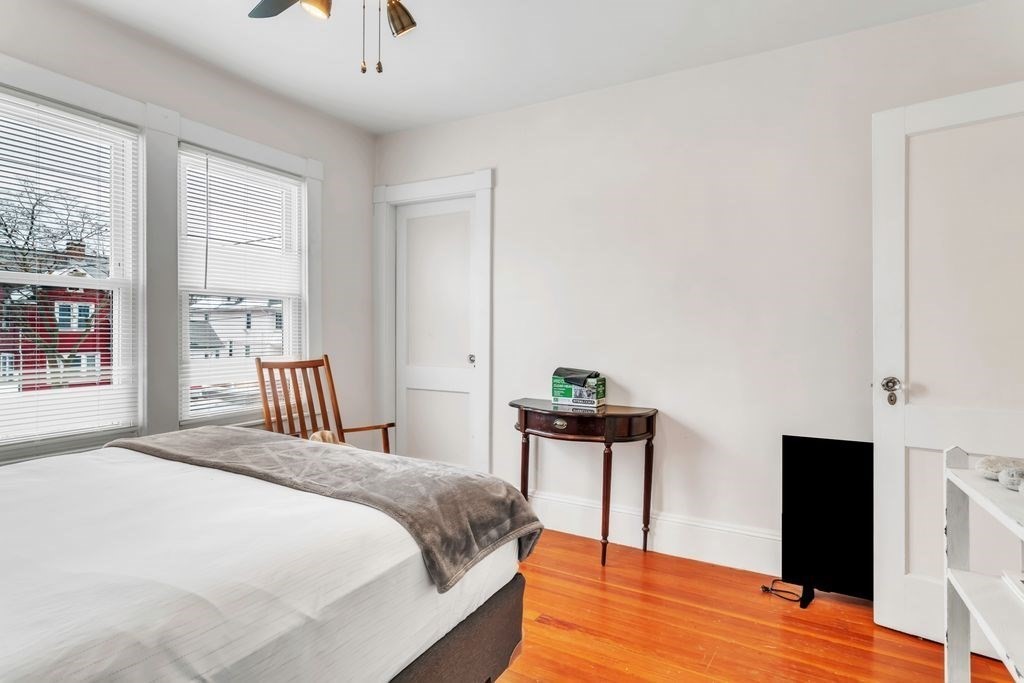 754 White Street Springfield, MA 01108 - Photo 28 of 41 a bedroom with a bed and a potted plant
