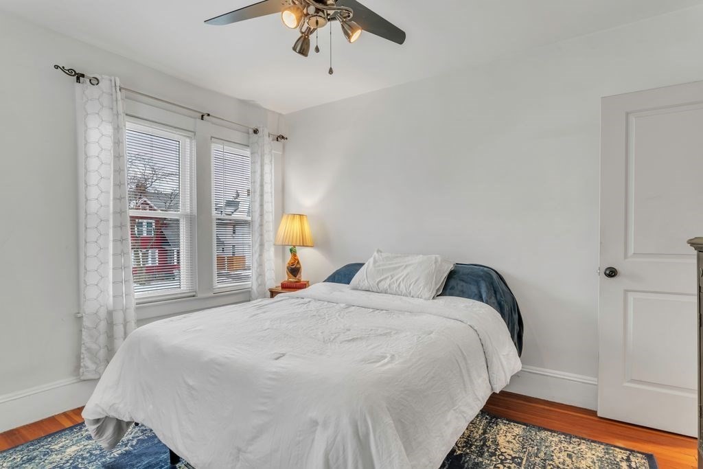 754 White Street Springfield, MA 01108 - Photo 29 of 41 a bedroom with a bed and a painting on the wall