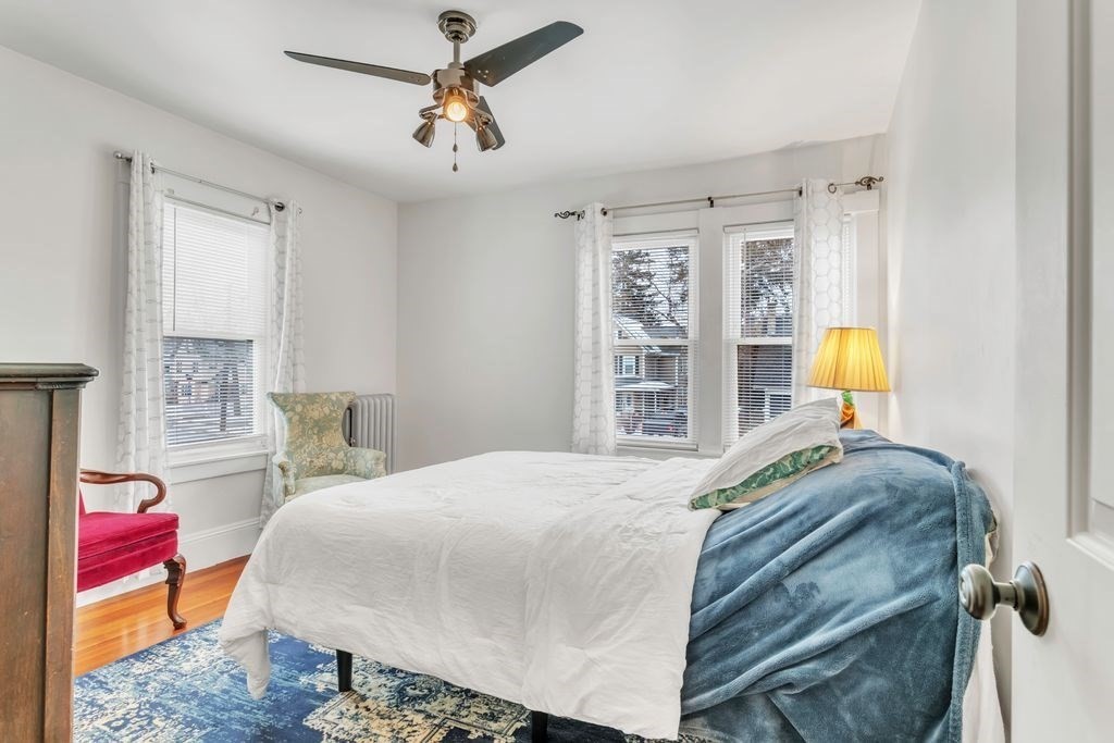 754 White Street Springfield, MA 01108 - Photo 30 of 41 a bedroom with a bed lamps and window