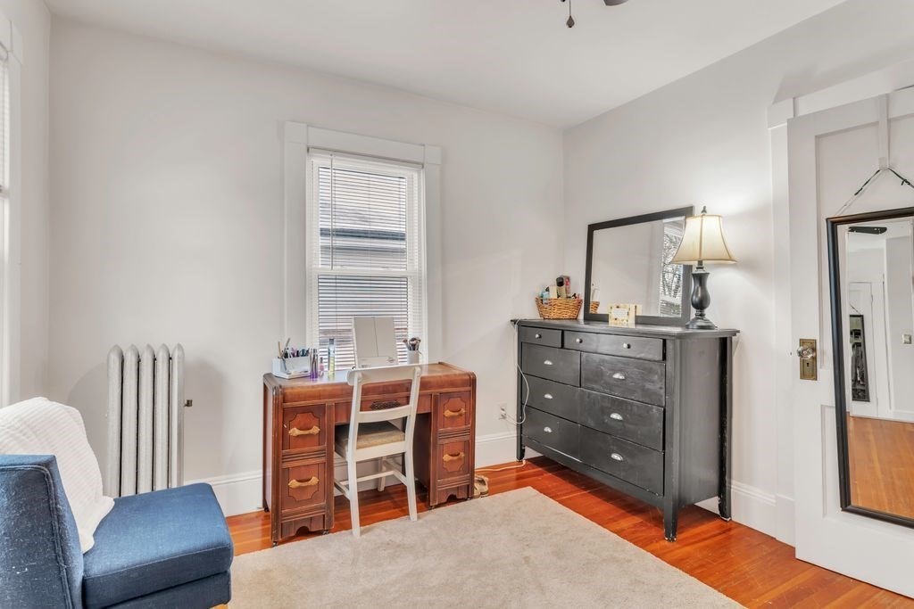 754 White Street Springfield, MA 01108 - Photo 33 of 41 a bed room with a bed and a chair