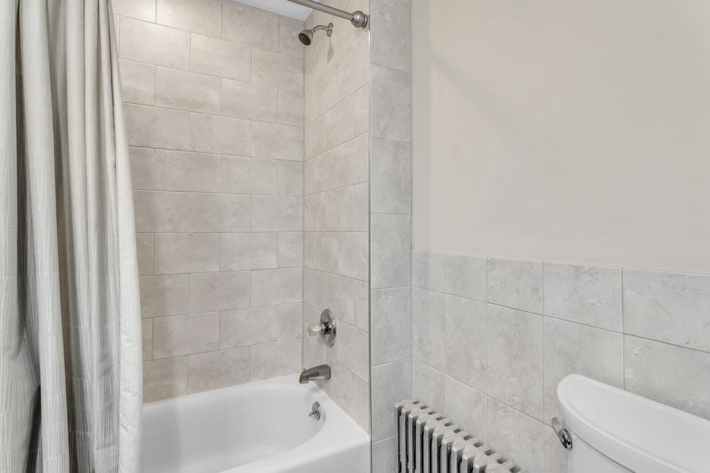 754 White Street Springfield, MA 01108 - Photo 35 of 41 a bathroom with a bathtub and a toilet