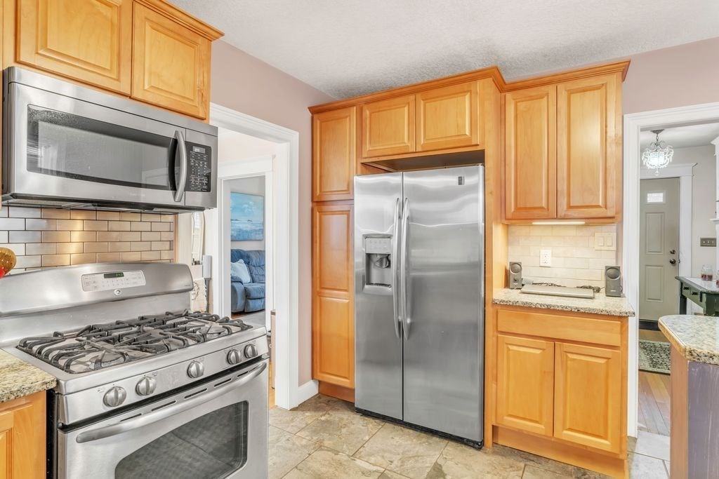 754 White Street Springfield, MA 01108 - Photo 5 of 41 a kitchen with stainless steel appliances granite countertop a stove a refrigerator and a cabinets